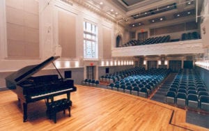 concert hall with piano on stage